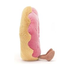 a hot dog stuffed animal with a pink bun on it's side and a yellow bun in the middle