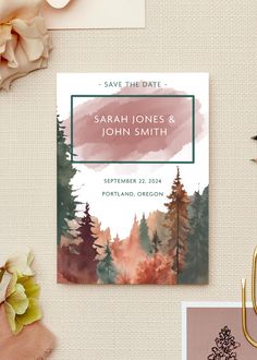 save the date cards with watercolor trees and pinks on them, along with other items