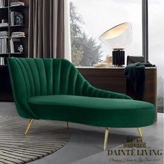 a green chair sitting in front of a window next to a book shelf and lamp