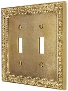 an ornate light switch plate cover with two toggles in antique brass finish, set of 2