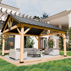 a covered patio with couches and tables in front of a house on the grass