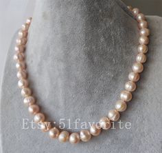 Jewelry: real cultured fresh water pearl color: natural pink color Size: about 10-11mm Grade: A have natural blemish and growth rings on pearls' surface! Length: offer different length Handwork: knotted between every 2 pearls clasp: alloy Shipping: I will send out your order in 1-5 business days. Usually will take about 25-50 business days. As seller, I really hope you will receive your parcel the earlier the better. Good luck! Elegant Pink Pearl Necklace For Anniversary, Formal Pink Round Pearl Necklace, Pink Round Pearl Necklace, Pink Round Pearl Drop Necklace, Pink Round Pearl Necklace Gift, Pink Pearl Drop Necklace, Pearl Necklace Bride, Bride Pearl Necklace, Big Pearl Necklace