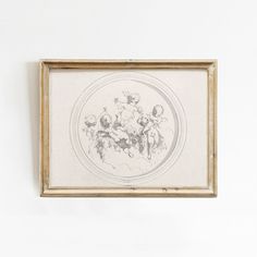 a painting hanging on the wall in front of a white wall with a wooden frame