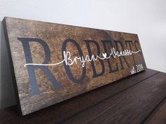 a wooden sign with the word roberts on it