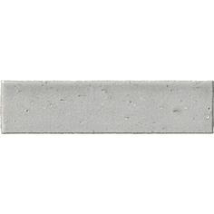 a white brick with speckles on the top and bottom part, against a white background