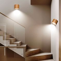 an image of a staircase with lights on the side and wood steps leading up to it