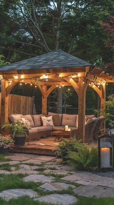 a wooden gazebo with lights on it