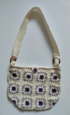 Beautiful handmade Crochet shoulder bag, perfect for everyday use. It is purple and cream in colour, with a square floral pattern. This bespoke bag measures 35cm (width) x 30cm (length), including the longer strap the total length of the bag is 70cm approx. The bag comes unlined, with a purple button fastening. It is made from double knit wool so very durable. Handmade by my super talented mum with love and joy. Each bag is completely unique! Flower Granny Square Crochet, Flower Granny Square, Crochet Shoulder Bag, Square Crochet, Double Knit, Purple Flower, Double Knitting, Handmade Crochet, Purple Flowers