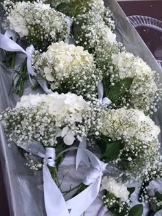 white flowers and baby's breath tied together