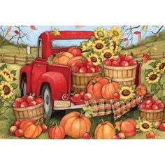 an old red truck filled with apples and sunflowers next to a basket full of pumpkins