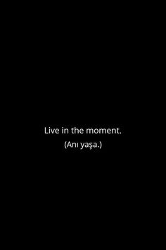 the words live in the moment ani yasa are written on a black background