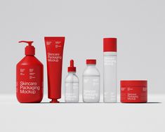 several different types of skin care products are arranged on a white surface with red caps