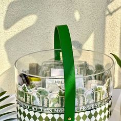 a green and white basket filled with lots of bottles