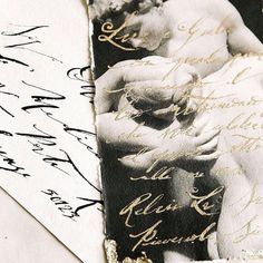 an old photo with writing on it next to a piece of paper that has been altered