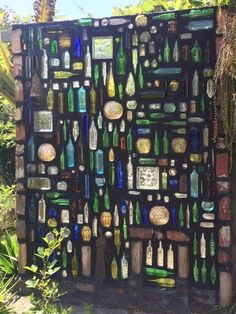 a wall made out of many different bottles