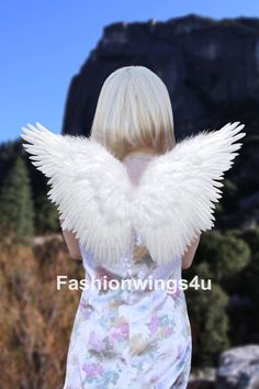 One pair of bendable feather wings with elastic shoulder straps  Approx. Wingspan (open flat, max left to right): 23.5 inches (60 cm) Approx. Wing height (open flat, max top to bottom): 16 inches (41 cm) Best fit children and juniors  Bleached White Natural feather & marabou, hand made Free elastic marabou halo ring included Our angel wings are designed and made with durability in mind.   All the wings we make are bendable at center.   We use white cardboards as base for the wings and add a wire in between to give the wings more flexibility so they can be bent to different angles and hold in that position.  The Angel of Fantasy style name was inspired from a butterfly fairy look.  We also have this style in black for children size, and XL size for adults (in separate listings). Multiple la Feather Angel Wings, Feather Wings, Wings Costume, Butterfly Fairy, Cardboard Packaging, White Feathers, Angel Wings, White Flats, Costume Accessories