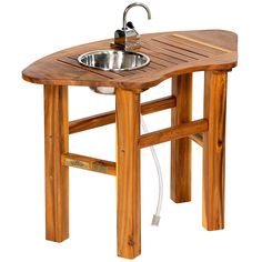 a wooden table with a sink and faucet attached to the top is shown