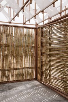 an empty room with wooden slats on the wall