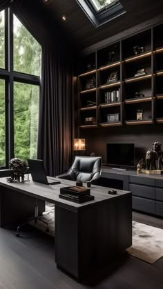 a modern home office with large windows and black furniture