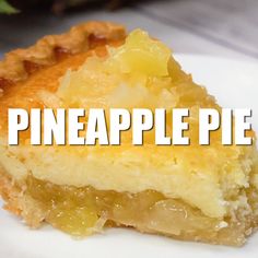 a piece of pie sitting on top of a white plate next to a pineapple