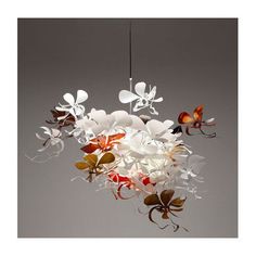 a chandelier with flowers and butterflies hanging from it