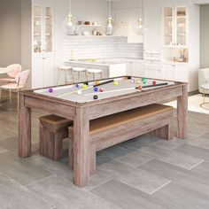 a pool table in the middle of a kitchen