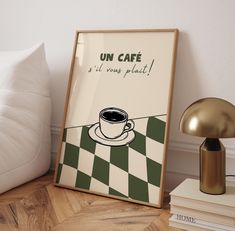 a coffee cup sitting on top of a green and white checkerboard floor next to a lamp