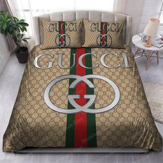 a bed with gucci logo on it