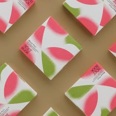 six pink and green business cards laid out on top of each other with the same design