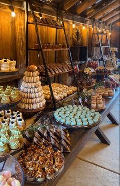 a table filled with lots of different types of desserts