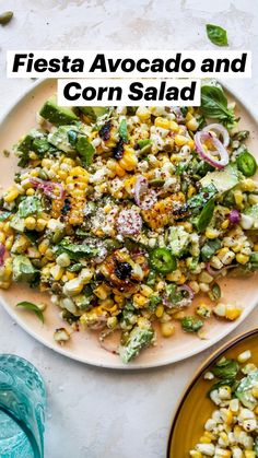 a white plate topped with corn salad on top of a table