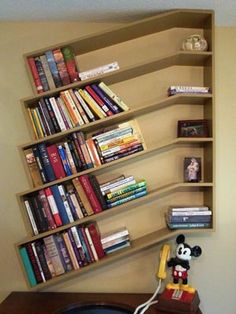 there is a book shelf with many books on it