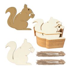 wooden cutouts of squirrel and squirrelling in a basket