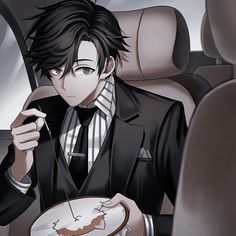 a man in a suit holding a plate with a piece of cake on it while sitting in the back seat of a car