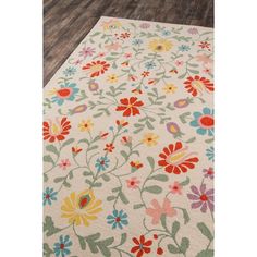 a white rug with colorful flowers on it