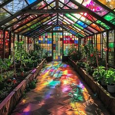 the inside of a glass house with lots of plants