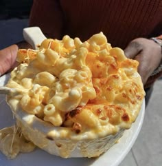 a white plate topped with macaroni and cheese