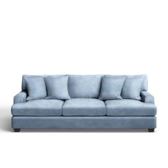 a blue couch sitting on top of a white floor