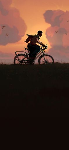 a person riding a bike in front of a sunset