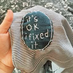 someone is holding up a piece of fabric that says it's okay to fix it