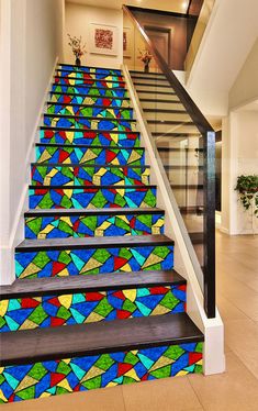 colorful stained glass stairs leading up to the second floor