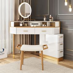 a dressing table with a mirror and stool