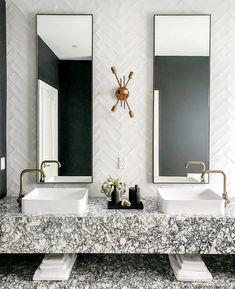 two sinks in a bathroom with mirrors above them