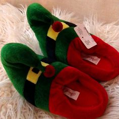 Grab These Today For The Season New With Tags By North Pole Trading Co. Soft Fuzzy Warm Elf Slip On Slippers With Character Design Kids Sized - S/M Length 6.5 Inches Long Wide 3 Inches Across The Toe Pad For Toddler Kids & M/L Toddlers In Kids Sizes 7 Inches Long & 3 Inch Wide Cross The Toe Pad Machine Washable More Kids Items And Shoes Available Bundle And Save Cute Green Non-slip Slippers, Cute Green Slippers With Round Toe, Playful Green Slippers With Round Toe, Casual Christmas Slippers With Round Toe, Ll Bean Slippers, Kids Ugg Slippers, Minnie Mouse Slippers, Minnetonka Slippers, Dinosaur Slippers