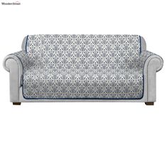 a couch with blue and white patterns on it