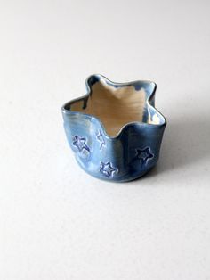 a blue and white bowl sitting on top of a table