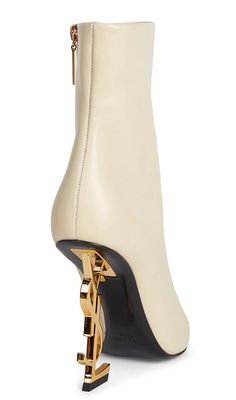 ANKLE BOOTS WITH A POINTED TOE AND SIDE ZIP CLOSURE, FEATURING A STRUCTURED HEEL WITH METAL YSL INITIALS. 100% CALFSKIN LEATHER TOTAL HEEL HEIGHT: 11 CM / 4.3 INCHES LEATHER SOLE HEEL IN CHROME-BLACK METAL STYLE ID 63959910NVV1000 MADE IN ITALY Ysl Boot Heel, Hermes Heels, Ysl Boots, Heart Shoes, Stiletto Boots, Gorgeous Shoes, Shoe Closet, Stiletto Pumps, Dream Shoes