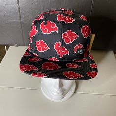 This Stylish Naruto Shippuden Snapback Cap Features The Iconic Akatsuki Cloud Pattern In Red And Black. It's Perfect For Any Anime Fan Looking To Add A Touch Of Coolness To Their Outfit. The Cap Is Made Of A Lightweight And Adjustable Blend Of Polyester And Cotton, Making It Suitable For All Seasons And Occasions. Whether You're Attending A Party Or Just Running Errands, This Unisex Snapback Cap Is A Must-Have Accessory. It's Not Signed Or Personalized, But It's Still A Great Addition To Any Col Akatsuki Cloud, Cloud Pattern, Red Cloud, Viz Media, Clouds Pattern, Snapback Cap, Red And Black, Naruto Shippuden, All Seasons