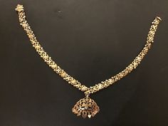 This is a Sri Lankan Vintage Silver Gold Plated Necklace. From the origin of Sri Lanka , this valuable necklace is probably from the capital city of Kandy. The screw is missing and can be replaced with a cord or other screw. It is a well sized choker necklace good for all events and wearing. It also has a nice bird design which is elegant and beautiful. This necklace is 32.7 grams The necklace is 35cm in length end to end. Sri Lankan Jewelry, Swan Necklace, Screw It, Kandy, Gold Plated Necklace, Bird Design, Capital City, Gold Jewellery, Wedding Necklace