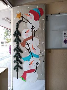 the door is decorated with snowmen and trees